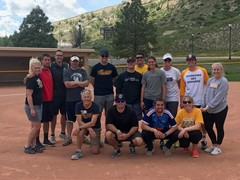 O’Kelly (back row, second from right) poses with the MSUB athletics staff after the 2017 staff softball game at Avitus Group Stadium in Billings, Mont.